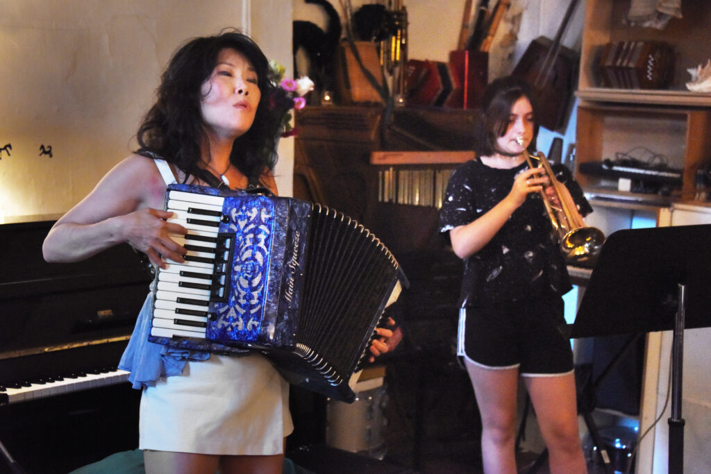 Lila Eaton on trumpet and Susan Hwang on accordion at the video release event for "Psalm to Aviation 58" based on the poem by Serhiy Zhadan.  The release event included live performances from Susan Hwang with Marlon Cherry on percussion and Lila Eaton on trumpet.